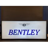 A showroom lightbox for Rolls-Royce and Bentley, the perspex panels having blue and gilded plastic