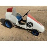 A large pedal car, appears scratch built circa 1950s, in the style of a single seater racing car.