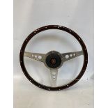 A good quality Jaguar three spoke aluminium and wooden rimmed steering wheel in excellent