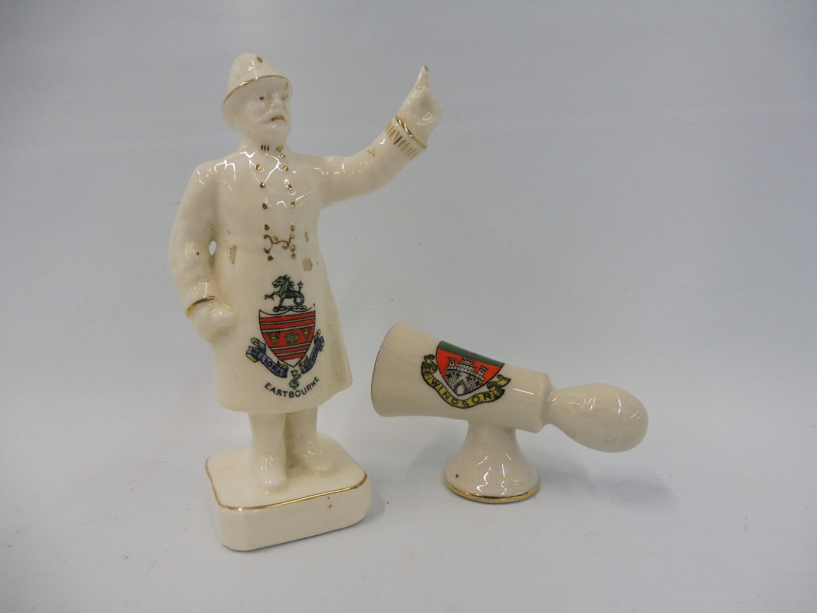 An Arcadian porcelain policeman for Eastbourne and a porcelain car horn stamped Windsor, by