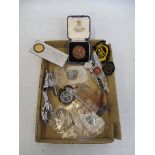 A tray of assorted lapel and cloth badges including a cased Motor Cycling Club medal presented for