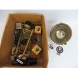 A box of assorted parts to include new old stock parking lamps, plus two ex-WD brass air pumps, a