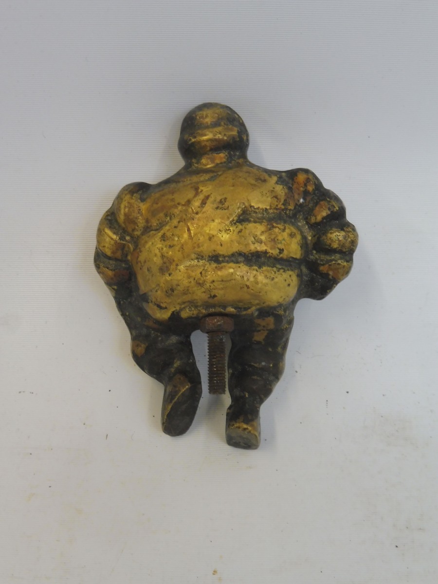 A small brass seated Michelin Mr. Bibendum figure. - Image 2 of 2