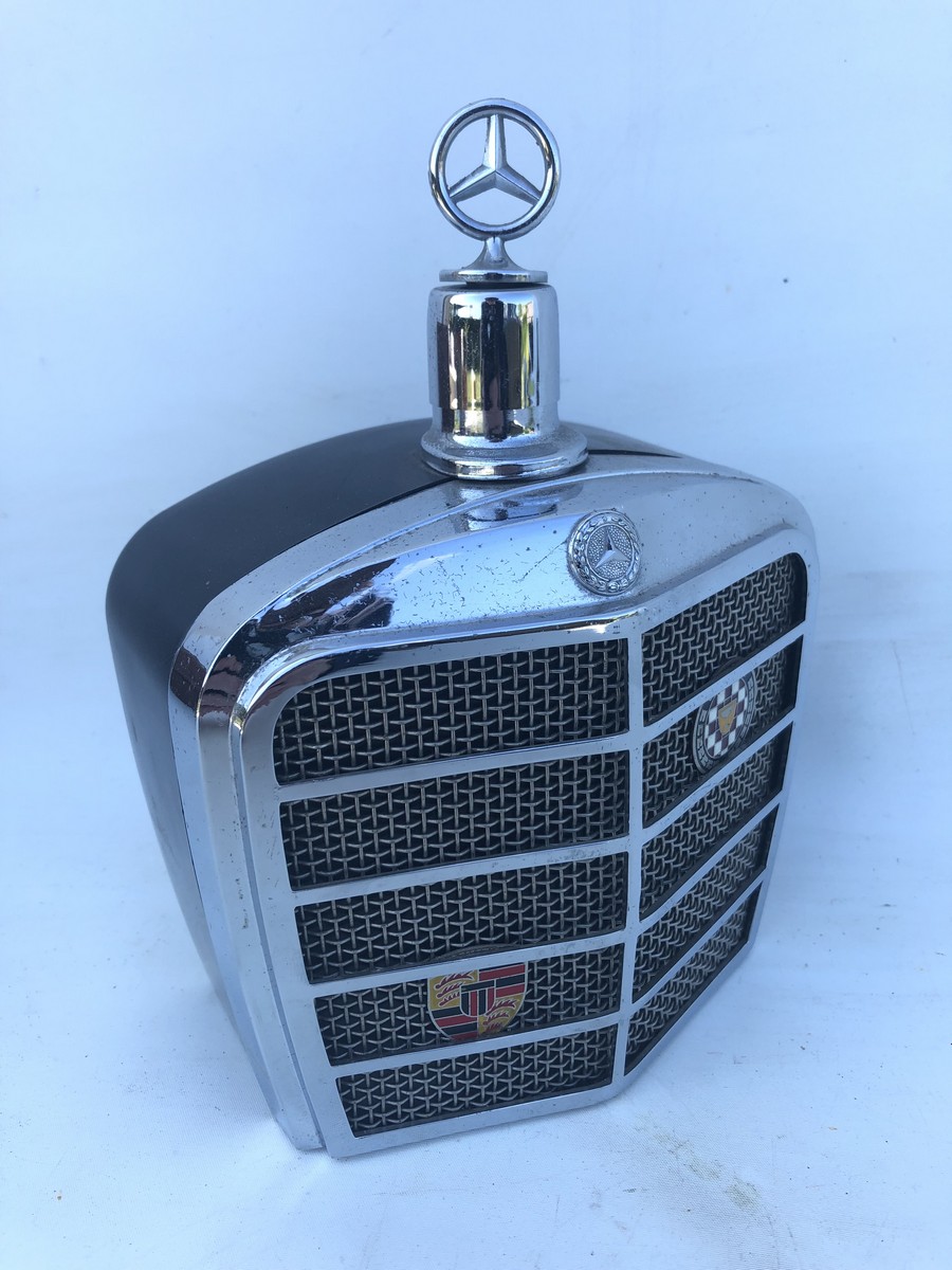 A Mercedes-Benz decanter in the form of a radiator.