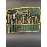 A tool roll with full contents including greasers, Dunlop tyre levers and several B.S.A. named
