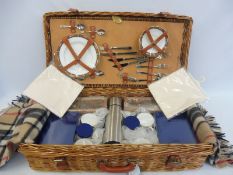 An Optima wicker cased picnic four person set, in excellent condition.