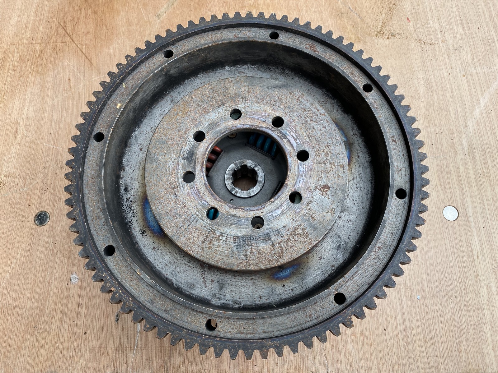 A flywheel, clutch and starter ring gear from an MG NA (previously fitted on the MG Bellevue).