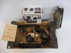 A box of assorted spares including a Bosch wiper motor, interior rear view mirror etc.