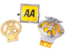 Three assorted AA badges.