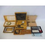 A collection of assorted precision instruments including a 1-2" cased micrometer, dials etc.