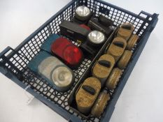 A tray of bicycle lamps including a set of four clipped into an original rack.