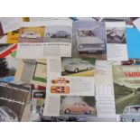 A quantity of American car brochures.