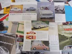 A quantity of American car brochures.