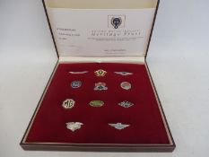 A cased group of Rover Heritage limited edition enamel badges 65/1000 produced by the Heritage