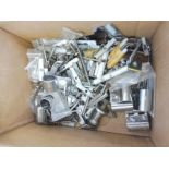 A box of badge bar fittings.