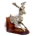 A large stag mascot mounted as a bookend.