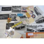 A tray of assorted motoring ephemera including original 1964 Le Mans window stickers, photographs,