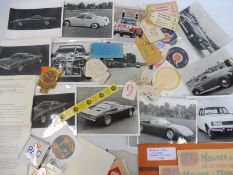 A tray of assorted motoring ephemera including original 1964 Le Mans window stickers, photographs,