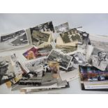 A box of motor racing photographs, some signed.