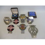 A selection of assorted car badges including two G.E.M. (Guild of Experienced Motorists), two HP (