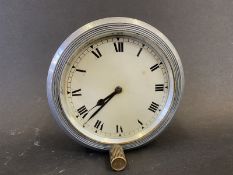 A Jaeger style eight day car clock, dial not marked, bottom wind.
