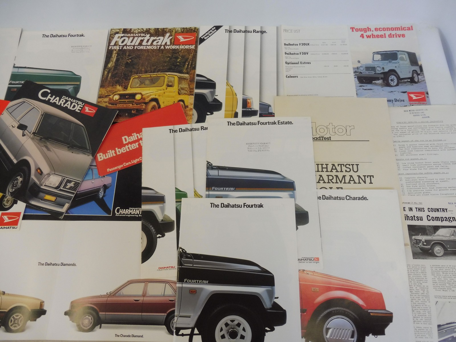 A quantity of Daihatsu brochures and leaflets.