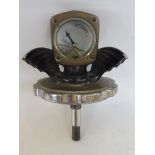 A Wilmot-Breeden calormeter with wings on a radiator cap with long stem to suit Morris.