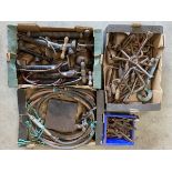 Four trays of vintage car tools.