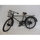 A metal model of a gent's bicycle.