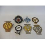 An Isle of Wight Traction Engine Club enamel badge plus various other badges.