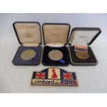 Three Lombard RAC Rally medals for 1984, 1988 and 1993 plus a plastic plaque.