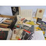 A box of assorted handbooks, motoring ephemera etc.