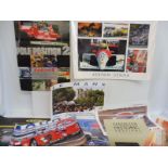 A collection of posters including Ferrari, Le Mans reproduction Monaco etc.
