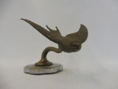 A Swallow car accessory mascot on a radiator cap.