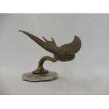 A Swallow car accessory mascot on a radiator cap.