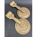 A pair of pressed brass windscreen mounted rear view mirrors.