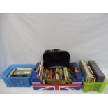 A collection of motoring books and a John Player Special bag etc