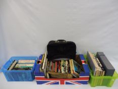 A collection of motoring books and a John Player Special bag etc