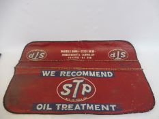 An original STP Oil mechanic's wing cover.