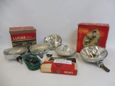 A collection of mostly Lucas new old stock including a revesing light with switch and bracket, a