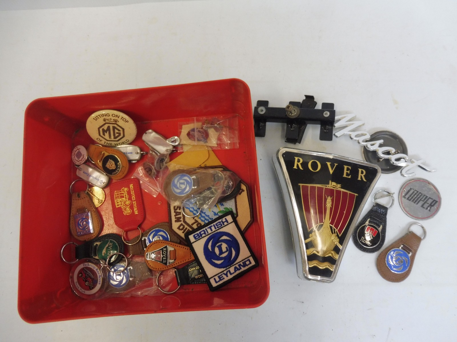 A quantity of motoring related keyrings, promotional badges, insignia etc.