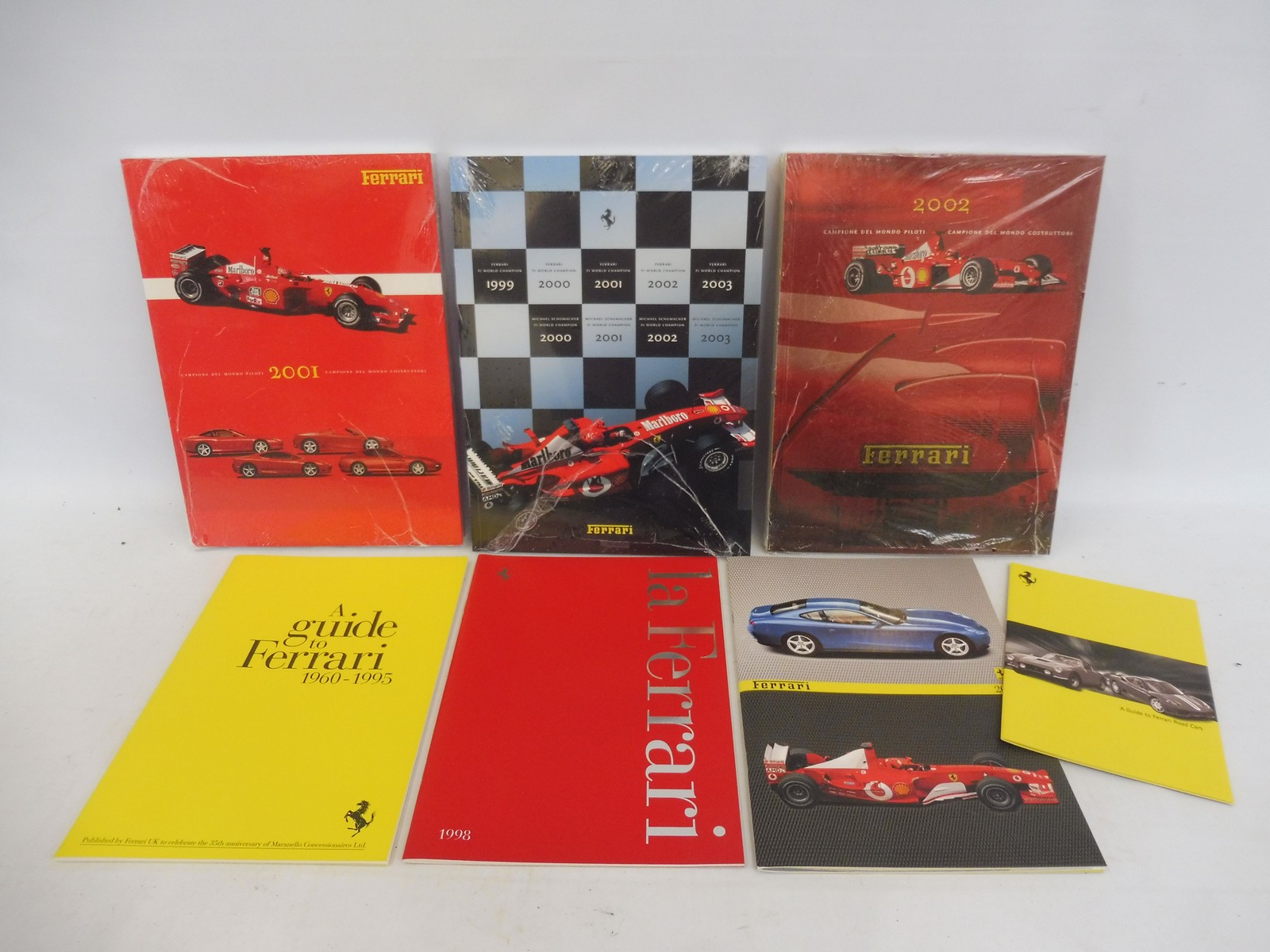 Three Ferrari year books: 2001-2003, still sealed plus various other Ferrari literature.