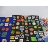 A collection of approximately 100 cloth sew-on badges relating to motorsport race meetings, car