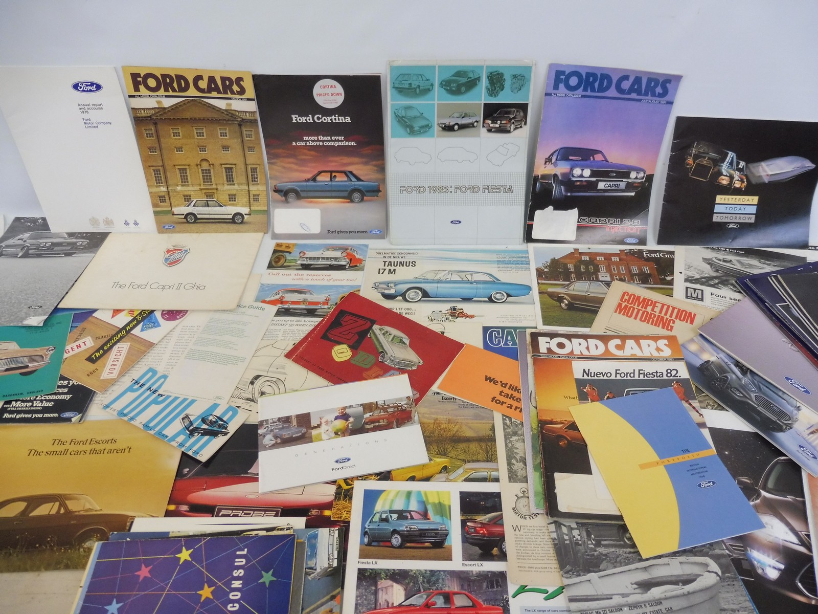 A quantity of Ford car brochures and leaflets.