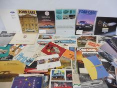 A quantity of Ford car brochures and leaflets.