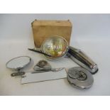 A small selection of chrome pieces including a boxed fog lamp, petrol filler cap etc.