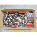 A quantity of early spark plugs, some boxed.