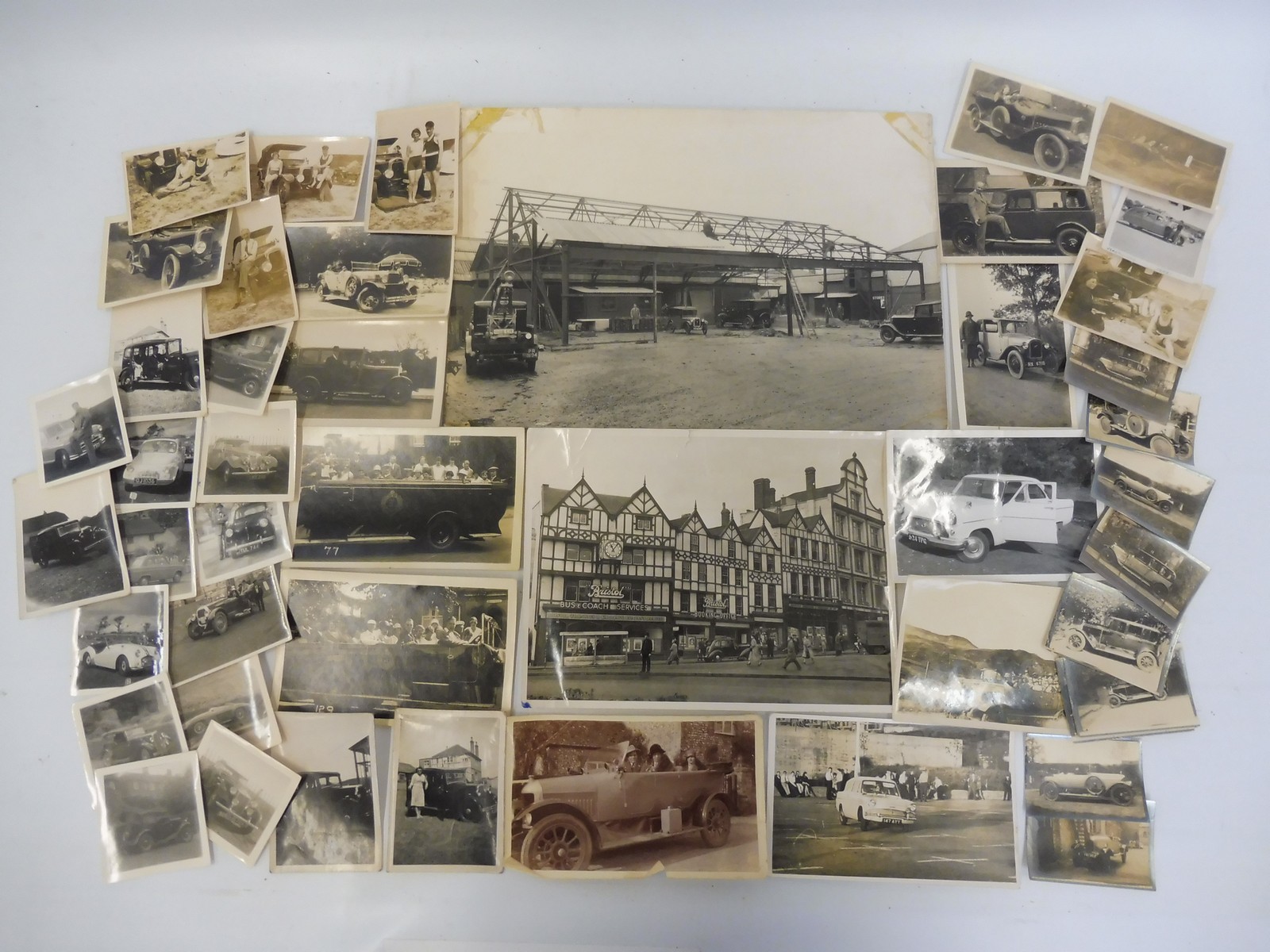 A selection of early black and white photographs of vintage cars including Morris, Austin 7,