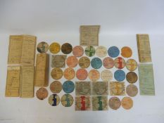 A selection of pre-war tax discs and log books.