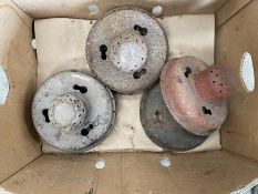 A box of Austin 7 wheel centres, some early.